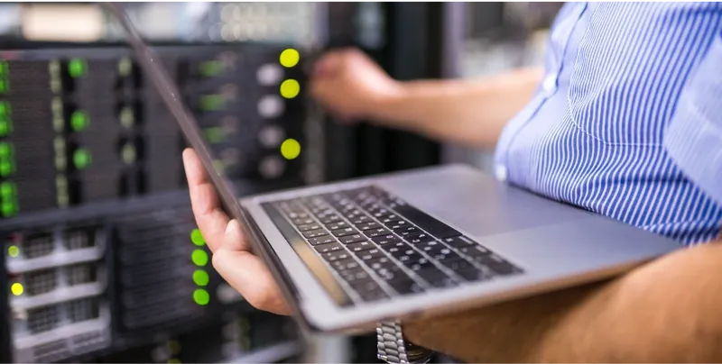 technician doing IT hardware maintenance on server